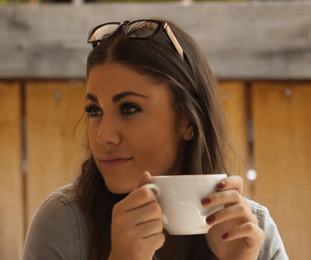 Young Woman Drinking Coffee